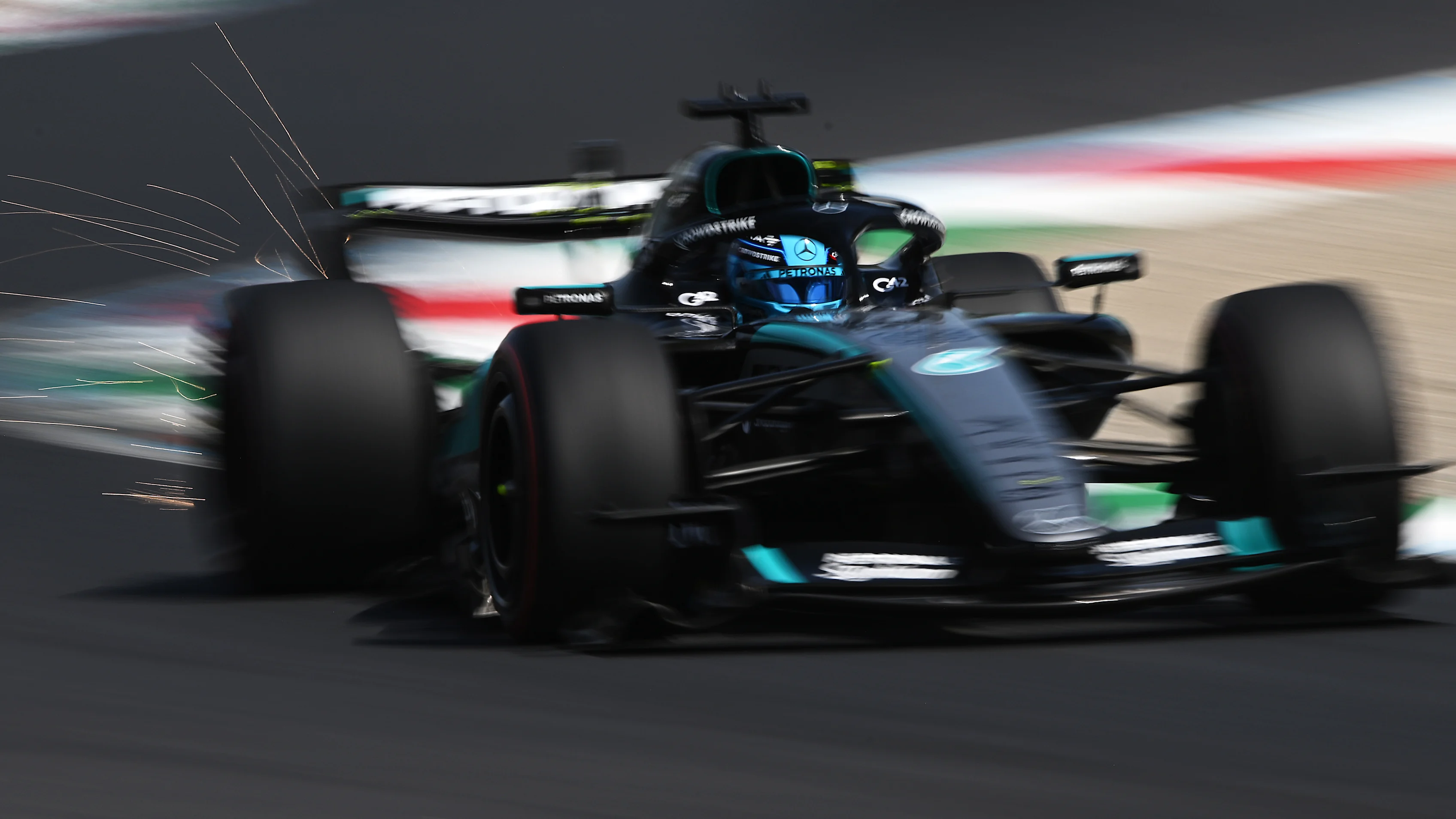 MONZA, ITALY - SEPTEMBER 05: Sparks fly behind George Russell of Great Britain driving the (63)
