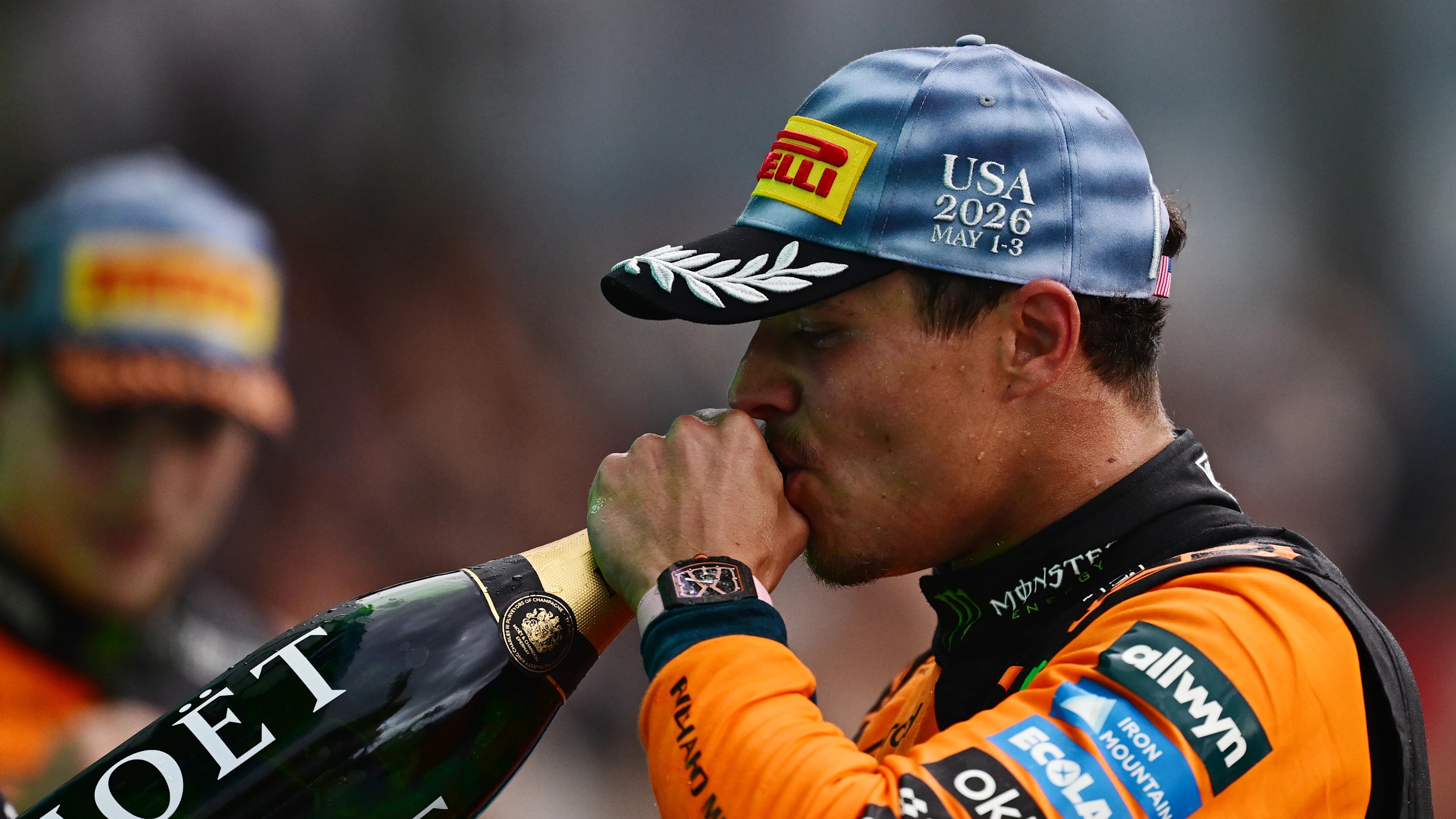 MIAMI, FLORIDA - MAY 03: Second placed Lando Norris of Great Britain and McLaren drinks Champagne