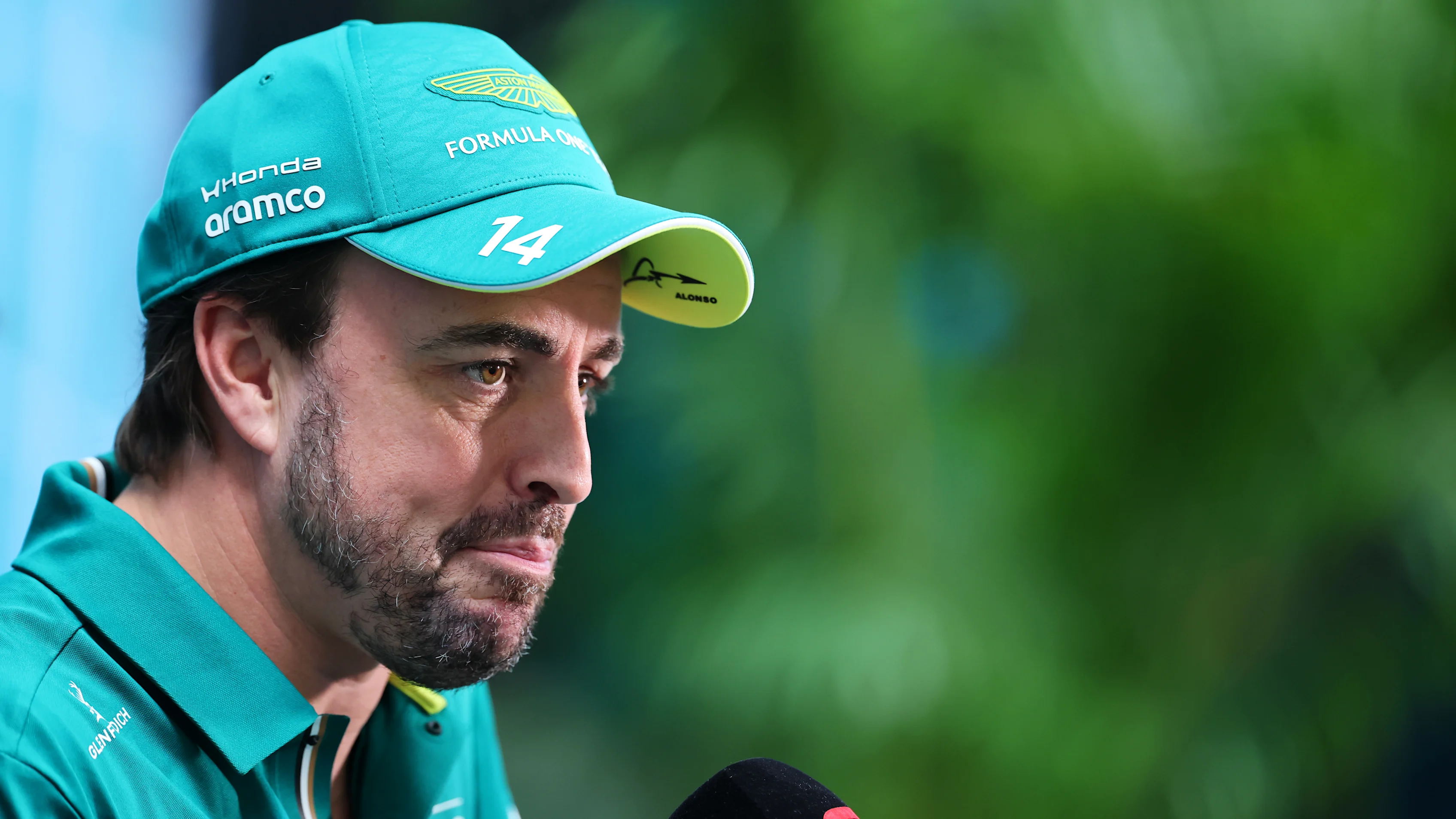 MIAMI, FLORIDA - APRIL 30: Fernando Alonso of Spain and Aston Martin F1 Team talks to the media