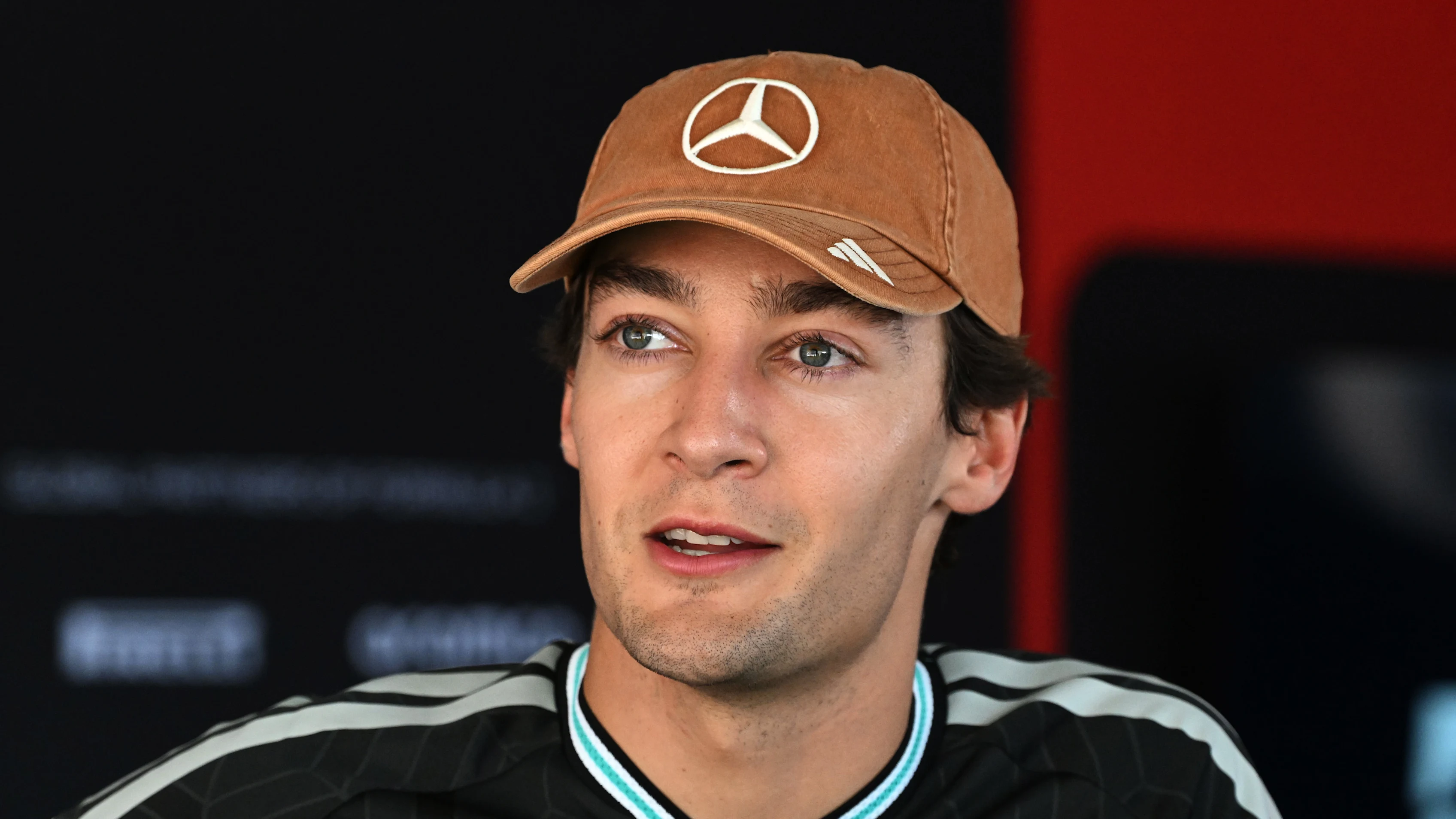 AUSTIN, TEXAS - OCTOBER 22: George Russell of Great Britain and Mercedes AMG Petronas F1 Team talks