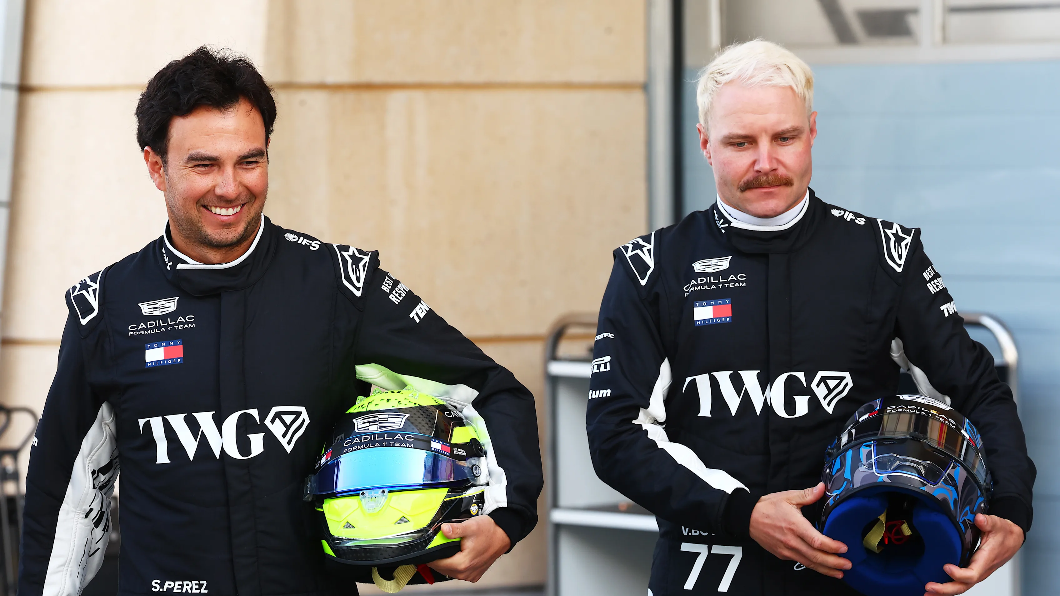 BAHRAIN, BAHRAIN - FEBRUARY 11: Sergio Perez of Mexico and Cadillac F1 Team and Valtteri Bottas of