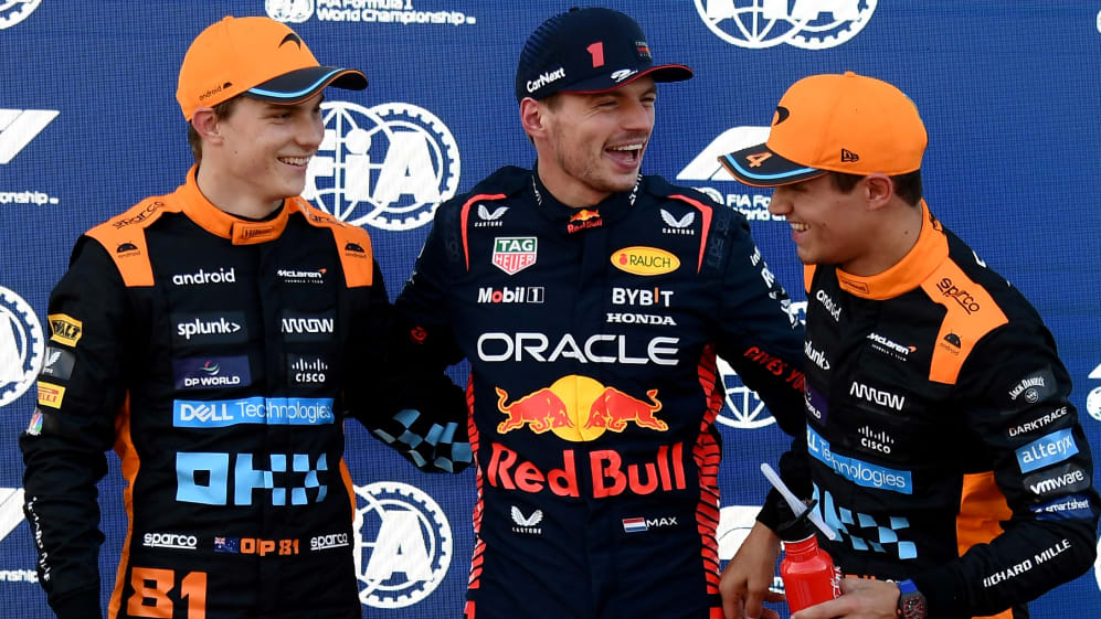 TOPSHOT - McLaren's Australian driver Oscar Piastri (L), Red Bull Racing's Dutch driver Max