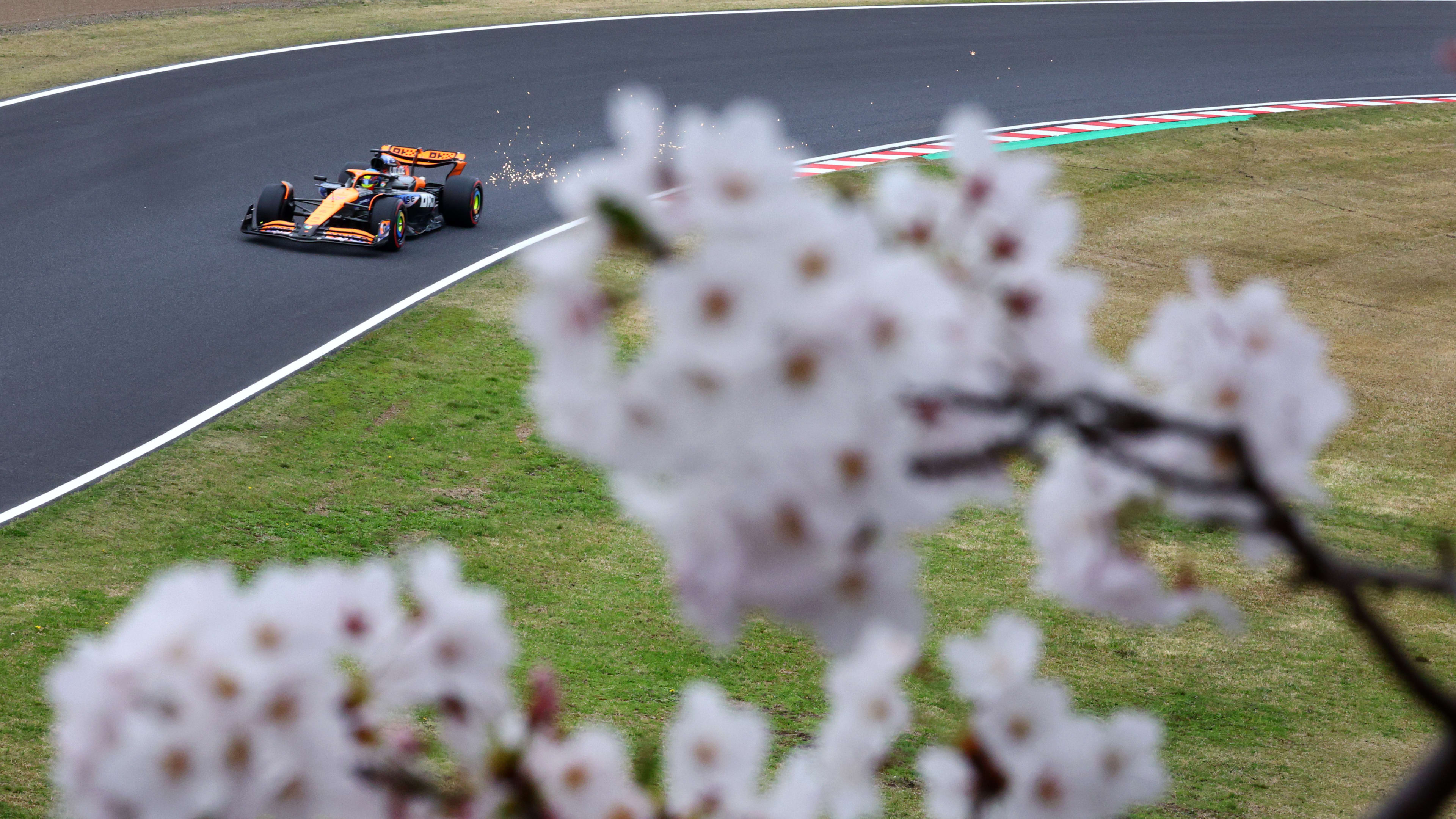 SUZUKA, JAPAN - APRIL 05: Sparks fly behind Oscar Piastri of Australia driving the (81) McLaren