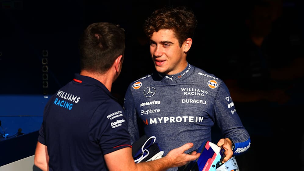 MONZA, ITALY - AUGUST 29: Franco Colapinto of Argentina and Williams talks with a Williams team