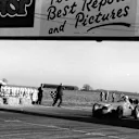 Giuseppe Farina crosses the line to win the first F1 World Championship Grand Prix