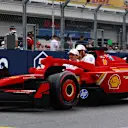 MIAMI, FLORIDA - MAY 04: Charles Leclerc of Monaco and Scuderia Ferrari and Lewis Hamilton of Great