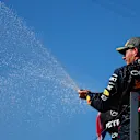 NORTHAMPTON, ENGLAND - JULY 07: Second placed Max Verstappen of the Netherlands and Oracle Red Bull Racing celebrates on the podium during the F1 Grand Prix of Great Britain at Silverstone Circuit on July 07, 2024 in Northampton, England. (Photo by Bryn Lennon - Formula 1/Formula 1 via Getty Images)