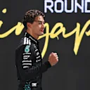 SINGAPORE, SINGAPORE - OCTOBER 04: Pole position qualifier George Russell of Great Britain and Mercedes AMG Petronas F1 Team celebrates in parc ferme during qualifying ahead of the F1 Grand Prix of Singapore at Marina Bay Street Circuit on October 04, 2025 in Singapore, Singapore. (Photo by Rudy Carezzevoli/Getty Images)