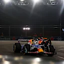 LAS VEGAS, NEVADA - NOVEMBER 22: Isack Hadjar of France driving the (6) Visa Cash App Racing Bulls VCARB 02 leads Oscar Piastri of Australia driving the (81) McLaren MCL39 Mercedes on track during the F1 Grand Prix of Las Vegas at Las Vegas Strip Circuit on November 22, 2025 in Las Vegas, Nevada. (Photo by Mark Thompson/Getty Images)