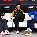 LAS VEGAS, NEVADA - NOVEMBER 19: Esteban Ocon of France and Haas F1, Lando Norris of Great Britain and McLaren and Franco Colapinto of Argentina and Alpine F1 attend the Drivers Press Conference during previews ahead of the F1 Grand Prix of Las Vegas at Las Vegas Strip Circuit on November 19, 2025 in Las Vegas, Nevada. (Photo by Clive Rose/Getty Images)