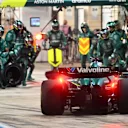 LUSAIL CITY, QATAR - NOVEMBER 30: Lance Stroll of Canada driving the (18) Aston Martin F1 Team AMR25 Mercedes makes a pitstop during the F1 Grand Prix of Qatar at Lusail International Circuit on November 30, 2025 in Lusail City, Qatar. (Photo by Mark Sutton - Formula 1/Formula 1 via Getty Images)