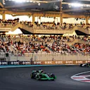 ABU DHABI, UNITED ARAB EMIRATES - DECEMBER 08: Zhou Guanyu of China driving the (24) Kick Sauber C44 Ferrari leads Alexander Albon of Thailand driving the (23) Williams FW46 Mercedes during the F1 Grand Prix of Abu Dhabi at Yas Marina Circuit on December 08, 2024 in Abu Dhabi, United Arab Emirates. (Photo by Joe Portlock/Getty Images)