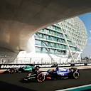 ABU DHABI, UNITED ARAB EMIRATES - DECEMBER 07: Lance Stroll of Canada driving the (18) Aston Martin AMR24 Mercedes and Liam Lawson of New Zealand driving the (30) Visa Cash App RB VCARB 01 on track during final practice ahead of the F1 Grand Prix of Abu Dhabi at Yas Marina Circuit on December 07, 2024 in Abu Dhabi, United Arab Emirates. (Photo by Bryn Lennon - Formula 1/Formula 1 via Getty Images)
