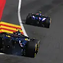 SPA, BELGIUM - JULY 28: Yuki Tsunoda of Japan driving the (22) Visa Cash App RB VCARB 01 leads Logan Sargeant of United States driving the (2) Williams FW46 Mercedes on track during the F1 Grand Prix of Belgium at Circuit de Spa-Francorchamps on July 28, 2024 in Spa, Belgium. (Photo by Rudy Carezzevoli/Getty Images)