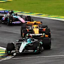 SAO PAULO, BRAZIL - NOVEMBER 03: George Russell of Great Britain driving the (63) Mercedes AMG Petronas F1 Team W15 leads Lando Norris of Great Britain driving the (4) McLaren MCL38 Mercedes at the start during the F1 Grand Prix of Brazil at Autodromo Jose Carlos Pace on November 03, 2024 in Sao Paulo, Brazil. (Photo by Peter Fox - Formula 1/Formula 1 via Getty Images)