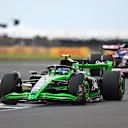 NORTHAMPTON, ENGLAND - JULY 07: Zhou Guanyu of China driving the (24) Kick Sauber C44 Ferrari leads Daniel Ricciardo of Australia driving the (3) Visa Cash App RB VCARB 01 during the F1 Grand Prix of Great Britain at Silverstone Circuit on July 07, 2024 in Northampton, England. (Photo by James Sutton - Formula 1/Formula 1 via Getty Images)
