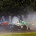 BUDAPEST, HUNGARY - JULY 19: Zhou Guanyu of China driving the (24) Kick Sauber C44 Ferrari spins in front of Sergio Perez of Mexico driving the (11) Oracle Red Bull Racing RB20 during practice ahead of the F1 Grand Prix of Hungary at Hungaroring on July 19, 2024 in Budapest, Hungary. (Photo by Mark Thompson/Getty Images)
