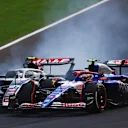 MONZA, ITALY - SEPTEMBER 01: Yuki Tsunoda of Japan driving the (22) Visa Cash App RB VCARB 01 and Nico Hulkenberg of Germany driving the (27) Haas F1 VF-24 Ferrari battle for track position during the F1 Grand Prix of Italy at Autodromo Nazionale Monza on September 01, 2024 in Monza, Italy. (Photo by Joe Portlock - Formula 1/Formula 1 via Getty Images)