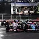 LAS VEGAS, NEVADA - NOVEMBER 23: Kevin Magnussen of Denmark driving the (20) Haas F1 VF-24 Ferrari and Liam Lawson of New Zealand driving the (30) Visa Cash App RB VCARB 01 compete for track position during the F1 Grand Prix of Las Vegas at Las Vegas Strip Circuit on November 23, 2024 in Las Vegas, Nevada. (Photo by Mark Sutton - Formula 1/Formula 1 via Getty Images)