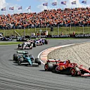 ZANDVOORT, NETHERLANDS - AUGUST 25: Carlos Sainz of Spain driving the (55) Ferrari SF-24 leads Lance Stroll of Canada driving the (18) Aston Martin AMR24 Mercedes during the F1 Grand Prix of Netherlands at Circuit Zandvoort on August 25, 2024 in Zandvoort, Netherlands. (Photo by James Sutton - Formula 1/Formula 1 via Getty Images)