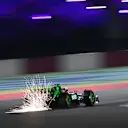 LUSAIL CITY, QATAR - NOVEMBER 30: Sparks fly behind Zhou Guanyu of China driving the (24) Kick Sauber C44 Ferrari during qualifying ahead of the F1 Grand Prix of Qatar at Lusail International Circuit on November 30, 2024 in Lusail City, Qatar. (Photo by Clive Mason/Getty Images)