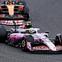 SUZUKA, JAPAN - APRIL 06: Oliver Bearman of Great Britain driving the (87) Haas F1 VF-25 Ferrari leads Lando Norris of Great Britain driving the (4) McLaren MCL39 Mercedes to the grid prior to the F1 Grand Prix of Japan at Suzuka Circuit on April 06, 2025 in Suzuka, Japan. (Photo by Clive Mason/Getty Images)