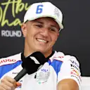 ABU DHABI, UNITED ARAB EMIRATES - DECEMBER 04: Isack Hadjar of France and Visa Cash App Racing Bulls speaks in the Drivers Press Conference during previews ahead of the F1 Grand Prix of Abu Dhabi at Yas Marina Circuit on December 04, 2025 in Abu Dhabi, United Arab Emirates. (Photo by Clive Rose/Getty Images)