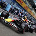 SPIELBERG, AUSTRIA - JUNE 28: Yuki Tsunoda of Japan driving the (22) Oracle Red Bull Racing RB21 leads Max Verstappen of the Netherlands driving the (1) Oracle Red Bull Racing RB21 in the Pitlane during qualifying ahead of the F1 Grand Prix of Austria at Red Bull Ring on June 28, 2025 in Spielberg, Austria. (Photo by Mark Thompson/Getty Images)