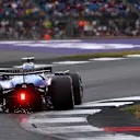 NORTHAMPTON, ENGLAND - JULY 05: Sparks fly behind Alexander Albon of Thailand driving the (23) Williams FW47 Mercedes on track during qualifying ahead of the F1 Grand Prix of Great Britain at Silverstone Circuit on July 05, 2025 in Northampton, England. (Photo by Malcolm Griffiths - Formula 1/Formula 1 via Getty Images)