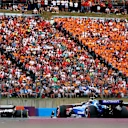 BUDAPEST, HUNGARY - AUGUST 03: Esteban Ocon of France driving the (31) Haas F1 VF-25 Ferrari leads Alexander Albon of Thailand driving the (23) Williams FW47 Mercedes on track during the F1 Grand Prix of Hungary at Hungaroring on August 03, 2025 in Budapest, Hungary. (Photo by Bryn Lennon - Formula 1/Formula 1 via Getty Images)