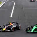 BUDAPEST, HUNGARY - AUGUST 03: Yuki Tsunoda of Japan driving the (22) Oracle Red Bull Racing RB21 and Nico Hulkenberg of Germany driving the (27) Kick Sauber C45 Ferrari battle for track position during the F1 Grand Prix of Hungary at Hungaroring on August 03, 2025 in Budapest, Hungary. (Photo by Joe Portlock/Getty Images)