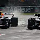 MONZA, ITALY - SEPTEMBER 07: Liam Lawson of New Zealand driving the (30) Visa Cash App Racing Bulls VCARB 02 and Yuki Tsunoda of Japan driving the (22) Oracle Red Bull Racing RB21 battle for track position during the F1 Grand Prix of Italy at Autodromo Nazionale Monza on September 07, 2025 in Monza, Italy. (Photo by Joe Portlock/Getty Images)