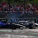 MONZA, ITALY - SEPTEMBER 07: Carlos Sainz of Spain driving the (55) Williams FW47 Mercedes and Oliver Bearman of Great Britain driving the (87) Haas F1 VF-25 Ferrari spin on track during the F1 Grand Prix of Italy at Autodromo Nazionale Monza on September 07, 2025 in Monza, Italy. (Photo by Joe Portlock/Getty Images)