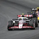 ZANDVOORT, NETHERLANDS - AUGUST 31: Oliver Bearman of Great Britain driving the (87) Haas F1 VF-25 Ferrari leads Yuki Tsunoda of Japan driving the (22) Oracle Red Bull Racing RB21 on track during the F1 Grand Prix of Netherlands at Circuit Zandvoort on August 31, 2025 in Zandvoort, Netherlands. (Photo by James Sutton/Getty Images)