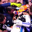 LUSAIL CITY, QATAR - NOVEMBER 30: Third placed Carlos Sainz of Spain and Williams celebrates with his team in parc ferme during the F1 Grand Prix of Qatar at Lusail International Circuit on November 30, 2025 in Lusail City, Qatar. (Photo by Peter Fox/Getty Images)