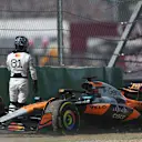 AUSTIN, TEXAS - OCTOBER 18: Oscar Piastri of Australia and McLaren walks away from his damaged car after a crash at the start during the Sprint ahead of the F1 Grand Prix of United States at Circuit of The Americas on October 18, 2025 in Austin, Texas. (Photo by Meg Oliphant/Getty Images)