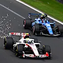 MELBOURNE, AUSTRALIA - MARCH 08: Sparks fly behind Oliver Bearman of Great Britain driving the (87) Haas F1 VF-26 Ferrari as he leads Carlos Sainz of Spain driving the (55) Williams FW48 Mercedes on track during the F1 Grand Prix of Australia at Albert Park Grand Prix Circuit on March 08, 2026 in Melbourne, Australia. (Photo by Mark Sutton - Formula 1/Formula 1 via Getty Images)