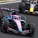 SUZUKA, JAPAN - MARCH 29: Pierre Gasly of France driving the (10) Alpine F1 A526 Mercedes leads Max Verstappen of the Netherlands driving the (3) Oracle Red Bull Racing RB22 Red Bull Ford on track during the F1 Grand Prix of Japan at Suzuka Circuit on March 29, 2026 in Suzuka, Japan. (Photo by Clive Mason/Getty Images)