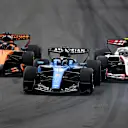 MONTREAL, QUEBEC - MAY 24: Alexander Albon of Thailand driving the (23) Williams FW48 Mercedes leads Oliver Bearman of Great Britain driving the (87) Haas F1 VF-26 Ferrari and Oscar Piastri of Australia driving the (81) McLaren MCL40 Mercedes on track during the F1 Grand Prix of Canada at Circuit Gilles-Villeneuve on May 24, 2026 in Montreal, Quebec. (Photo by James Sutton - Formula 1/Formula 1 via Getty Images)