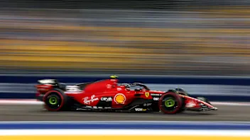 SINGAPORE, SINGAPORE - SEPTEMBER 15: Sparks fly behind Carlos Sainz of Spain driving (55) the