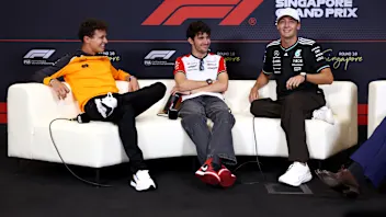 SINGAPORE, SINGAPORE - OCTOBER 02: Lando Norris of Great Britain and McLaren, Esteban Ocon of
