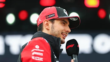 NORTHAMPTON, ENGLAND - JULY 05: Esteban Ocon of France and Haas F1 talks to the crowd on the