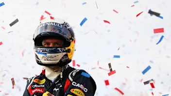MILTON KEYNES, ENGLAND - DECEMBER 10:  Sebastian Vettel of Germany and Red Bull Racing acknowledges