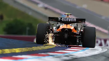 SPIELBERG, AUSTRIA - JUNE 27: Sparks fly behind Lando Norris of Great Britain driving the (4)