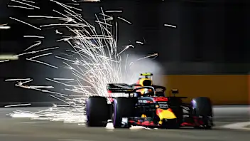 SINGAPORE - SEPTEMBER 14:  Sparks fly behind Max Verstappen of the Netherlands driving the (33)