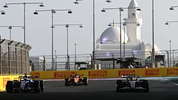 JEDDAH, SAUDI ARABIA - APRIL 17: Lewis Hamilton of Great Britain and Scuderia Ferrari talks with a
