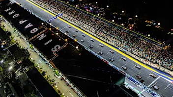SINGAPORE, SINGAPORE - SEPTEMBER 17: A general view as cars leave the grid at the start of the race