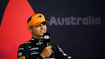 MELBOURNE, AUSTRALIA - MARCH 24: Third placed Lando Norris of Great Britain and McLaren attends the