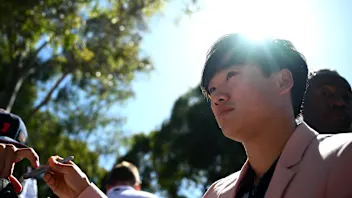MELBOURNE, AUSTRALIA - MARCH 21: Yuki Tsunoda of Japan and Visa Cash App RB arrives on the