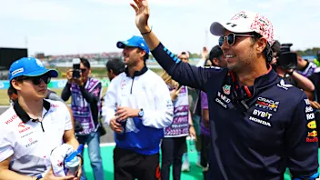 SUZUKA, JAPAN - APRIL 07: Sergio Perez of Mexico and Oracle Red Bull Racing waves to the crowd on